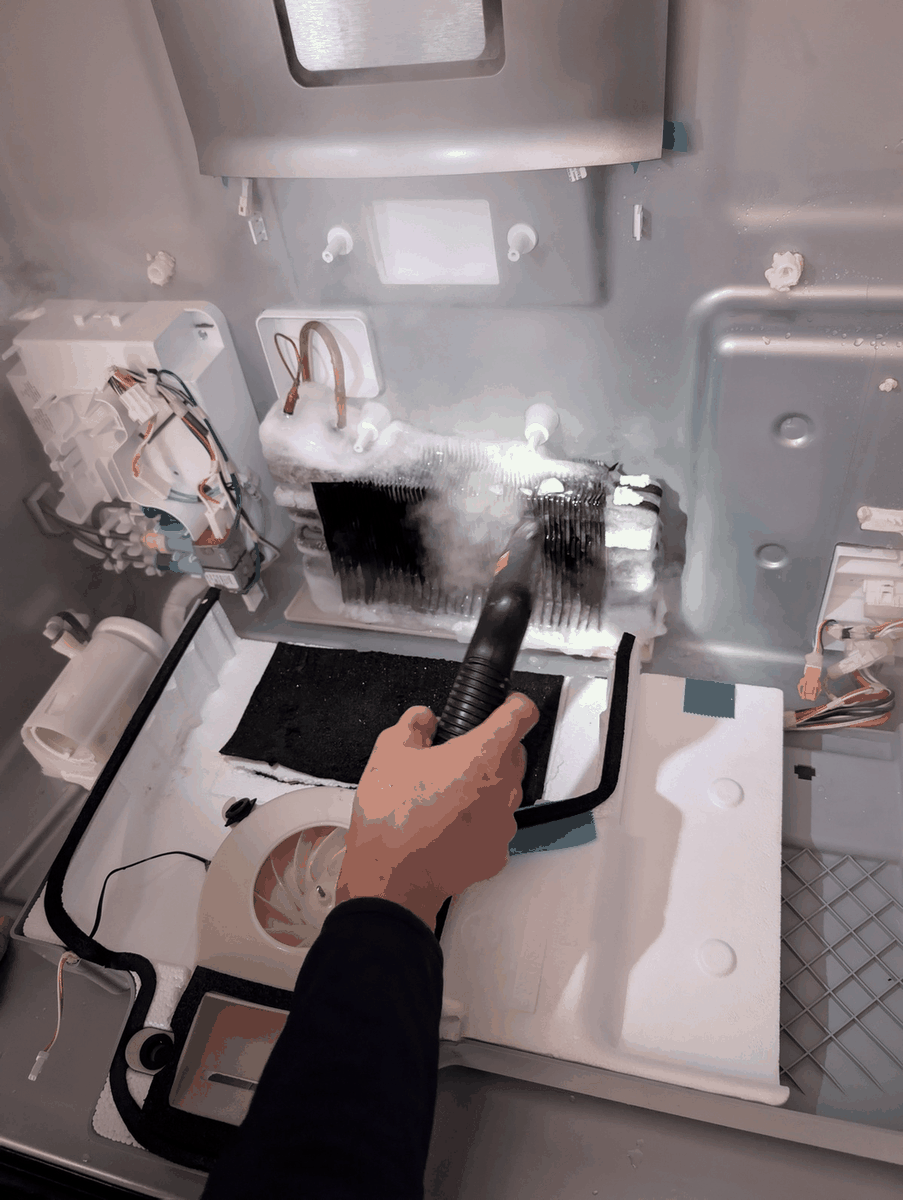 DTA technician diagnosing cooling failure on a GE side-by-side refrigerator in Center City Philadelphia